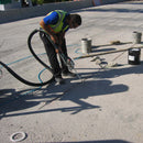 Worker using the AST CMP-632 wand to fill in concrete crack