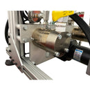 Detailed view of the AST GMP 025 pump system, showing the motor, stainless steel housing, and yellow-handled fluid control valves for precision dispensing.