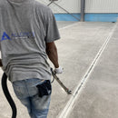 Worker using the AST GMP-025 to fill in cracks