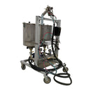 Side view of the AST GMP 075-I meter mix system, showing dual stainless steel tanks, dispensing hoses, and a mobile aluminum frame.