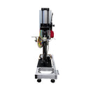 Rear view of the AST SE-5 single-component dispensing system, showcasing the vertical ram and support frame for pail placement.