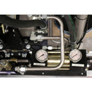 Top-down image of dual metering pump cylinders showing 2000–2500 PSI pressure ratings on the HG SB system.