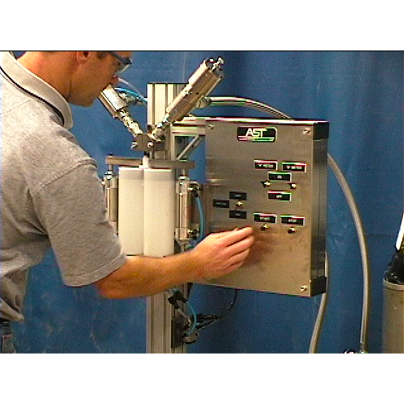 Action shot of adhesive cartridge filling equipment