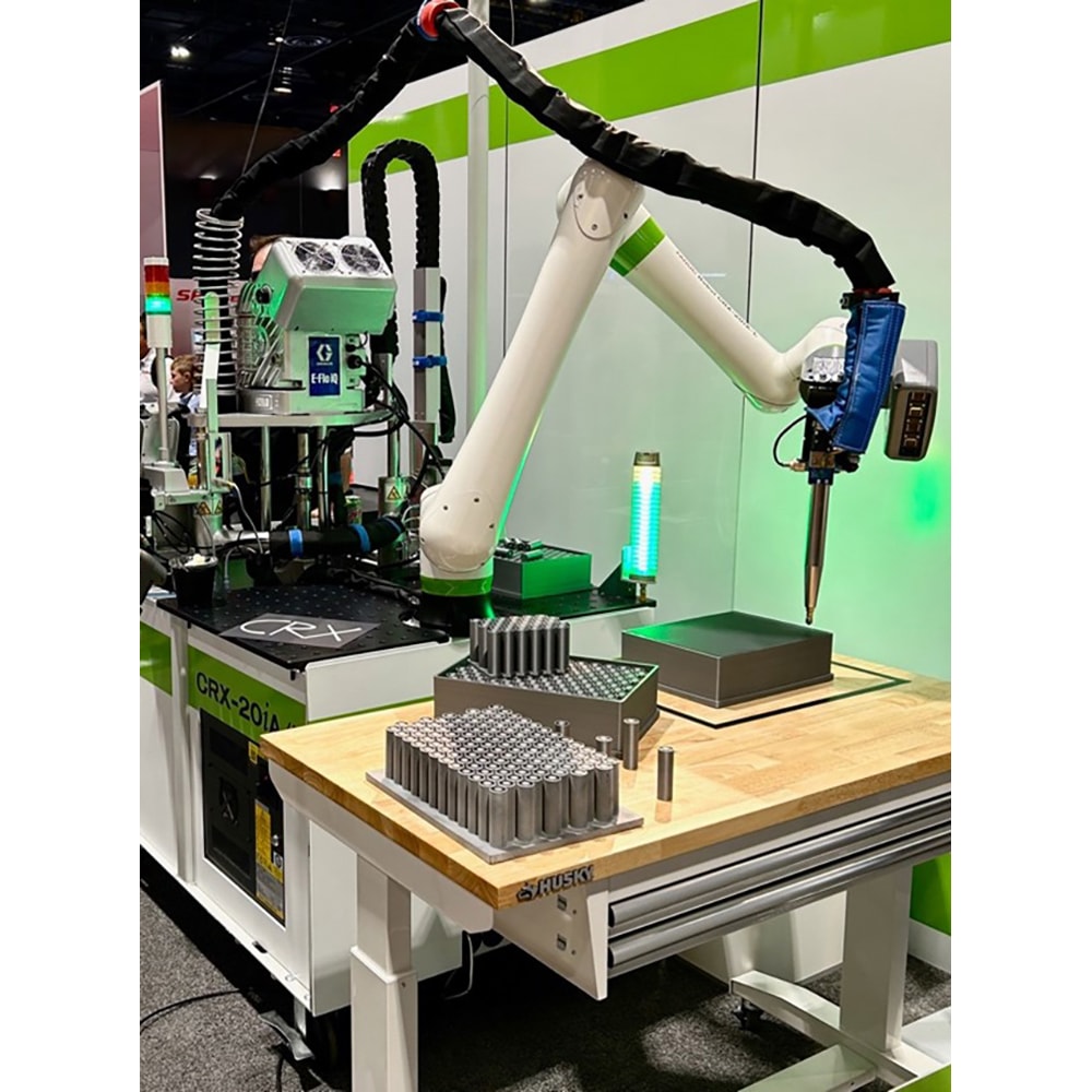 A Fanuc CRX robot in a dispensing cell demo cell.