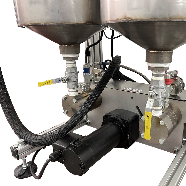 Close-up of the AST GMP 025 motorized pump assembly, with dual stainless steel tanks and fluid control valves for metering and dispensing applications.