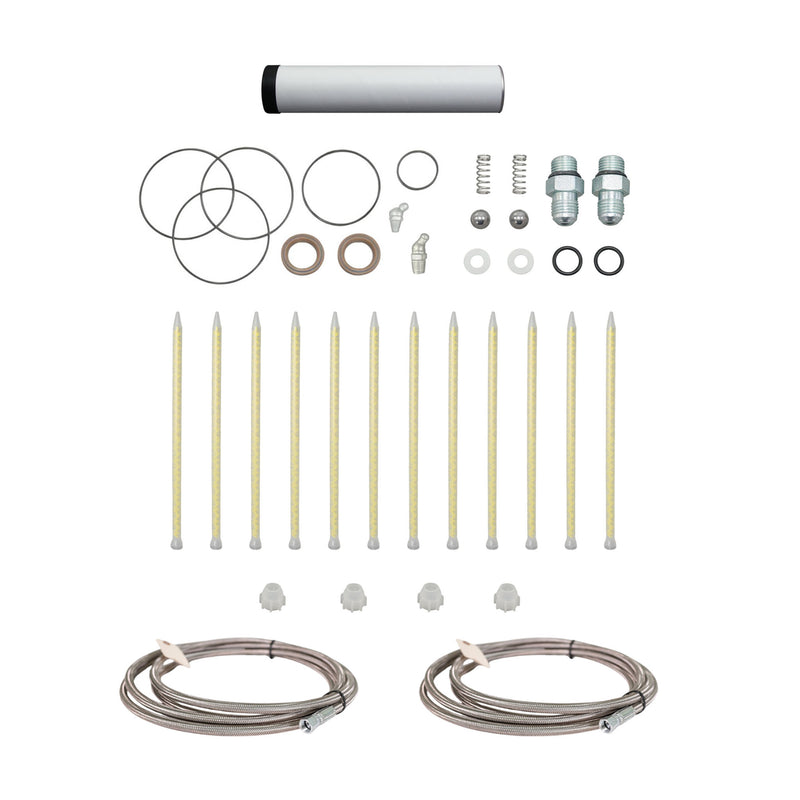 AST GMP-025 Spare Parts Kit showing replacement O-rings, fittings, springs, static mixers, and stainless steel braided hoses neatly arranged on a white background.