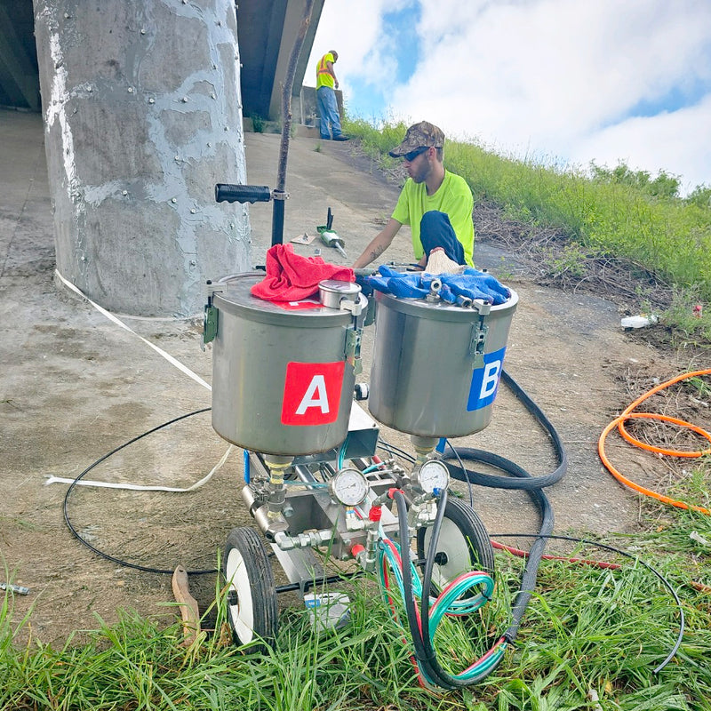 Dispensing system being used to repair concrete cracks